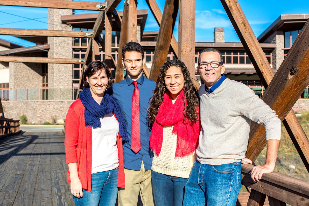 Family portrait by a wooden bridge