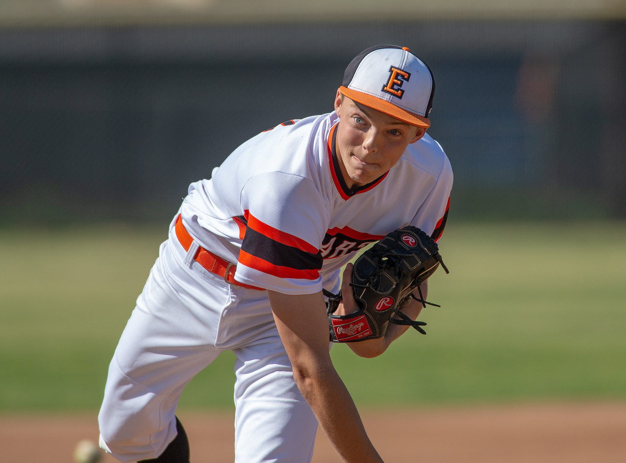 Pitcher following through toward the plate